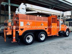 2001 INTERNATIONAL 4900 CAMION BARRENADOR CON CANASTILLA d