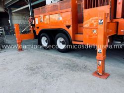 2001 INTERNATIONAL 4900 CAMION BARRENADOR CON CANASTILLA g