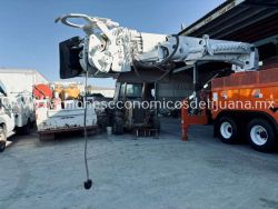 2001 INTERNATIONAL 4900 CAMION BARRENADOR CON CANASTILLA i